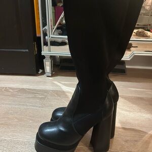 High heeled black boots